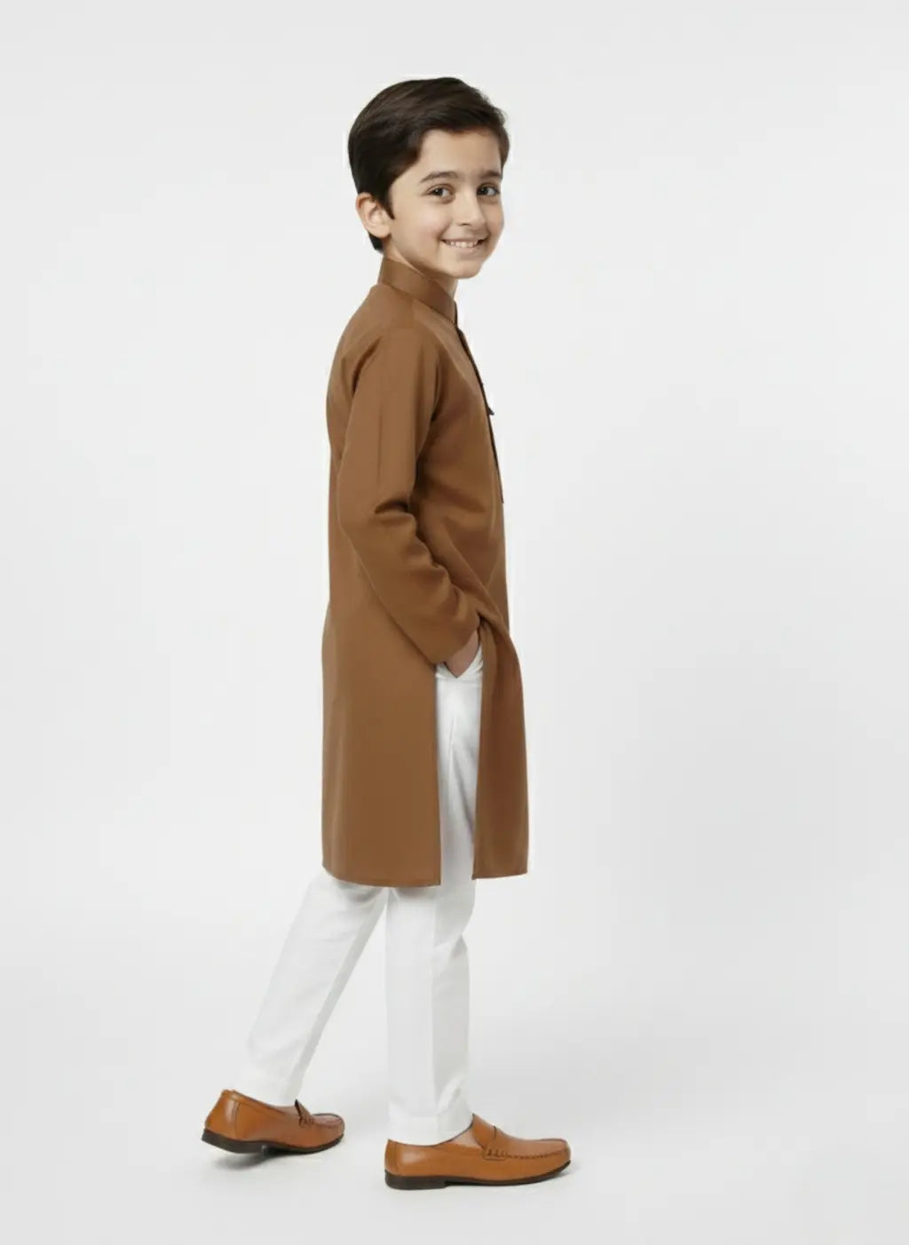 Child wearing a brown coat and white pants on a white background