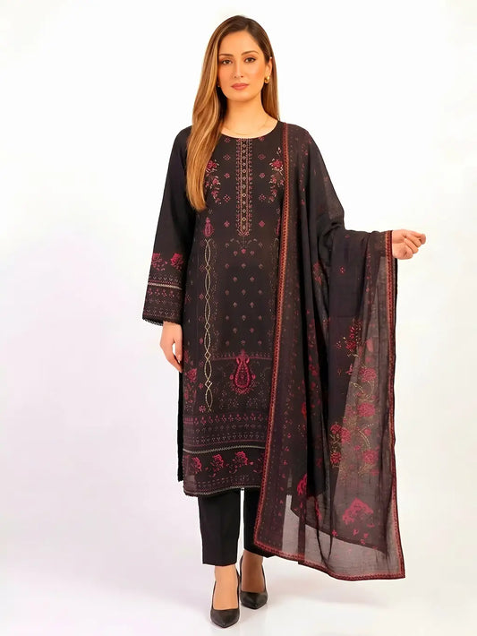 Woman wearing a black embroidered outfit with a dupatta on a white background