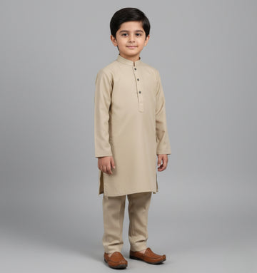 Child wearing a beige kurta set on a gray background