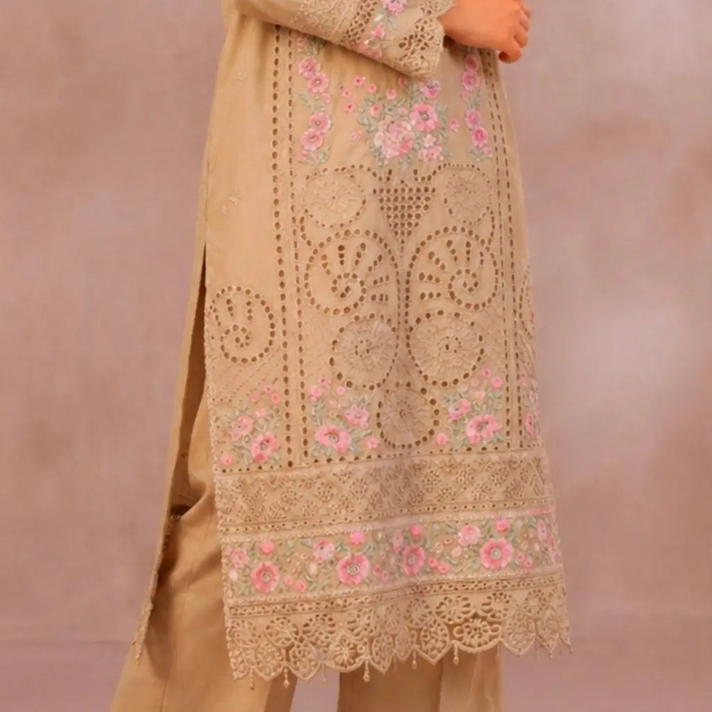 Beige embroidered outfit with pink floral patterns on a plain background
