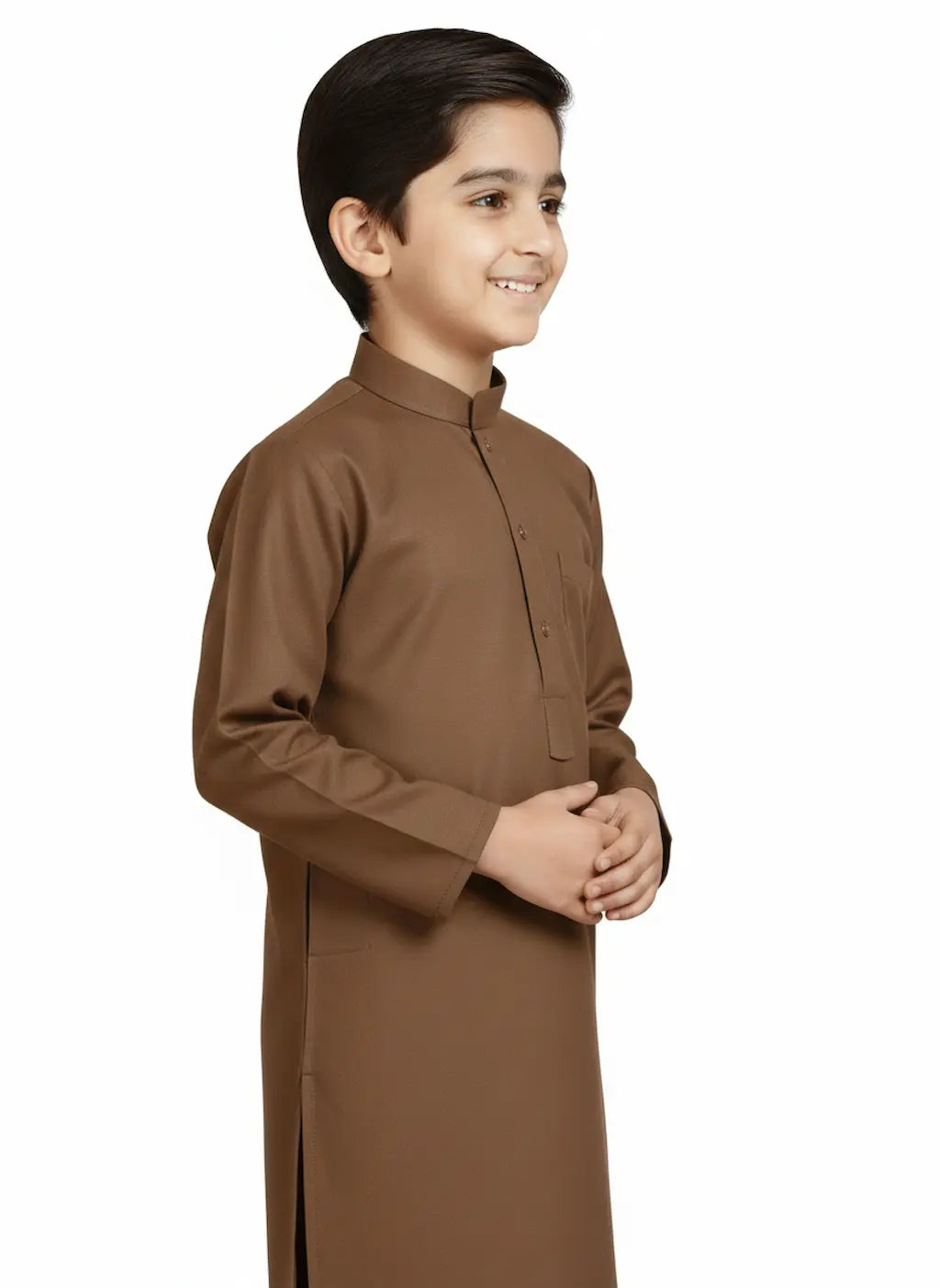 Young boy wearing a brown traditional outfit on a white background