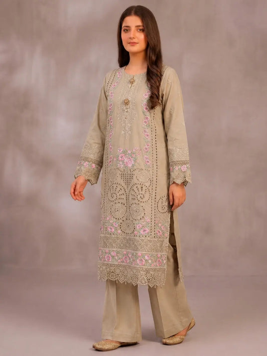 Model wearing a 3PC beige floral Chikankari embroidered cotton lawn suit with pink floral details and intricate laser-cut lace border.