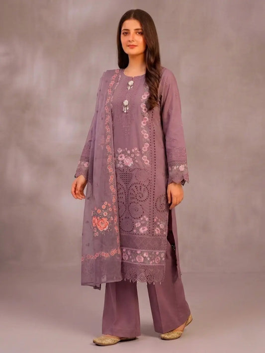 Woman wearing a purple embroidered outfit against a plain background