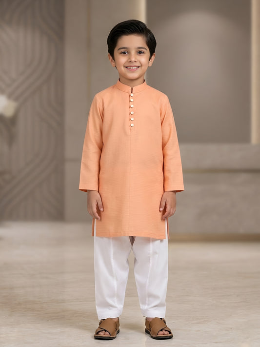 Boys 2-piece ethnic outfit featuring a jacquard cotton kurta in soft peach tone with white shalwar, designed in a traditional stylish fit with breathable fabric for comfortable kids wea